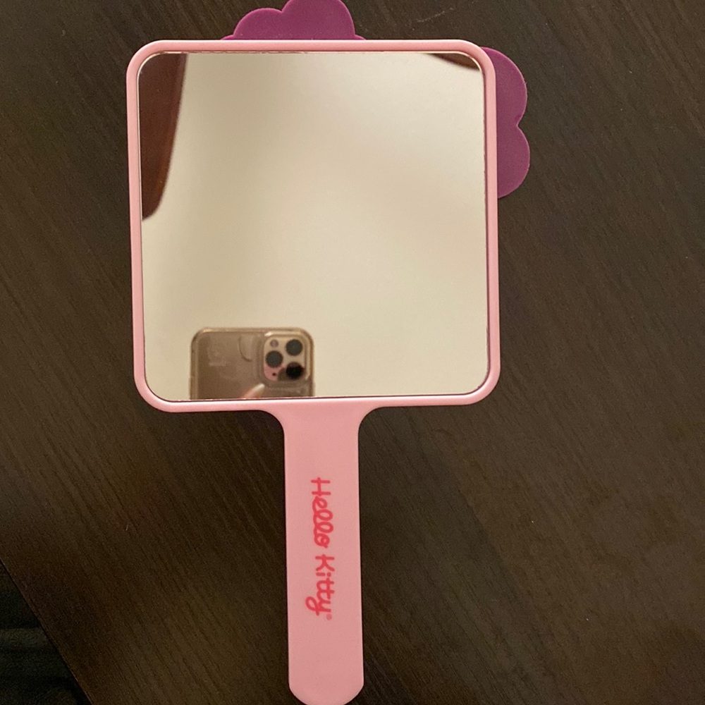 A 5 x 5 handheld hello kitty mirror
